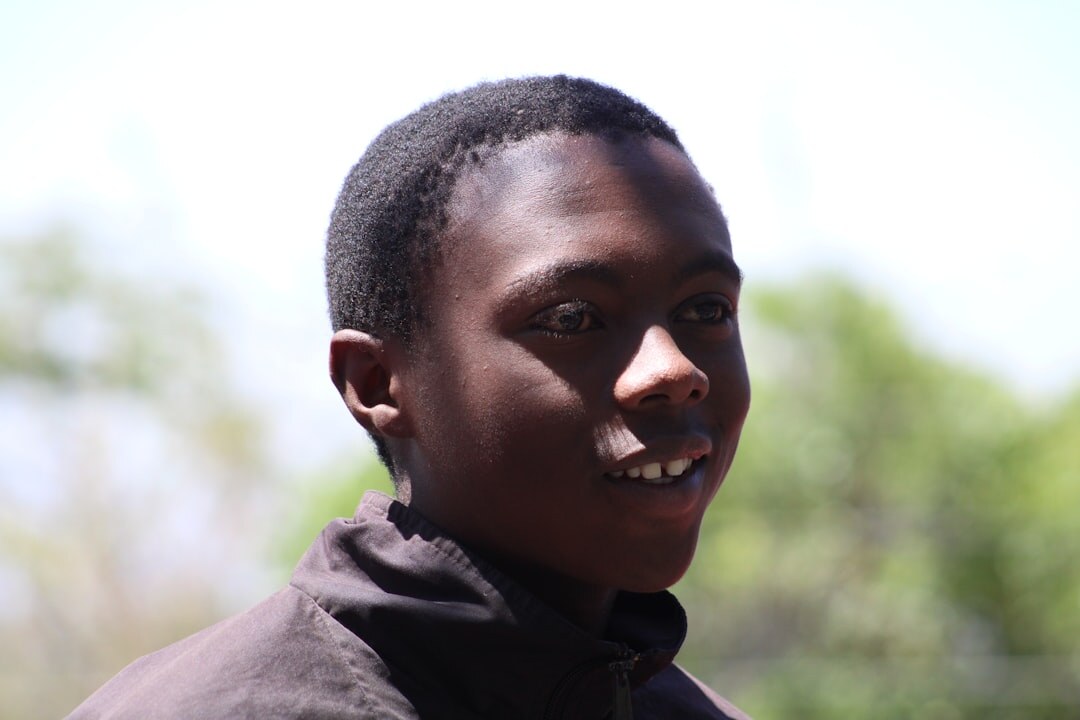 Portrait of a smiling young man with short hair